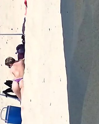 Spying on a hot MILF on Biscorosse Beach France