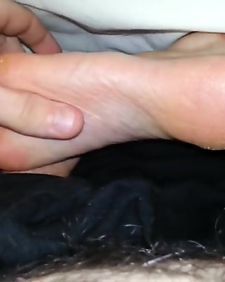 Quick footjob while my gf is in bed
